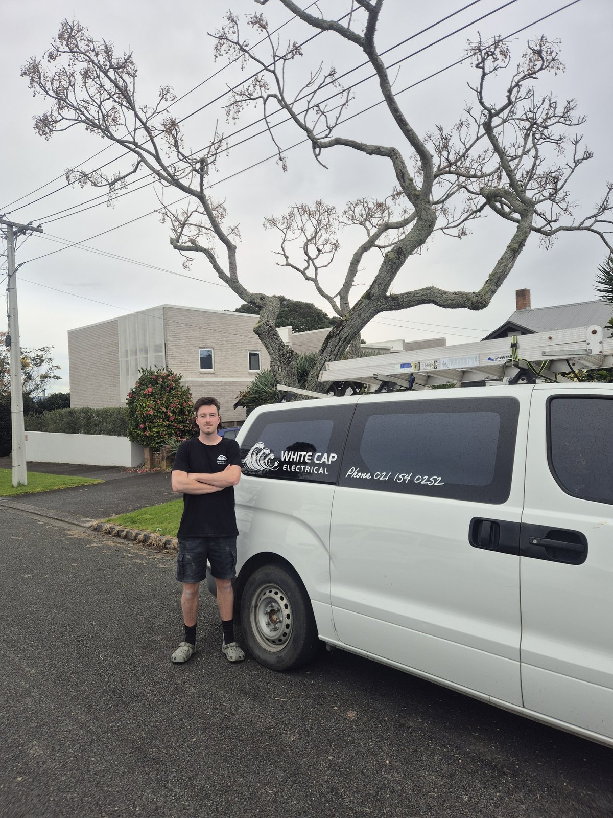 The White Cap Electrical van and electrician on the job